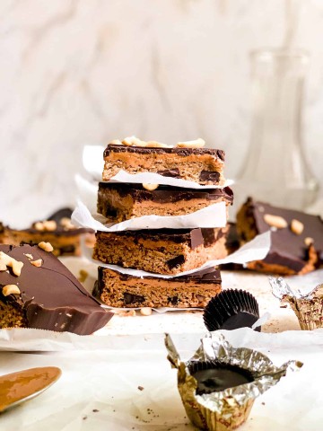 Stack of Homemade Dessert Bars with Peanut Butter and Melted Dark Chocolate