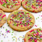Sprinkle sugar cookies on a parchment paper lined baking sheet.