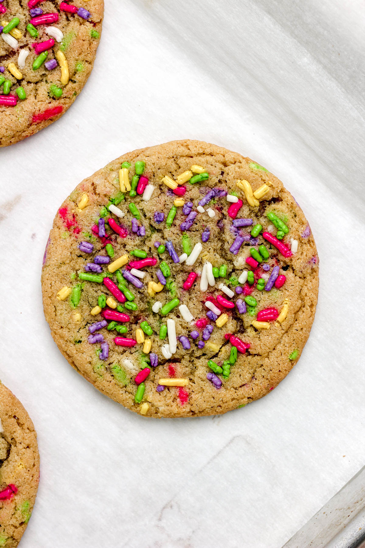 Sprinkle sugar cookies on a parchment paper lined baking sheet.
