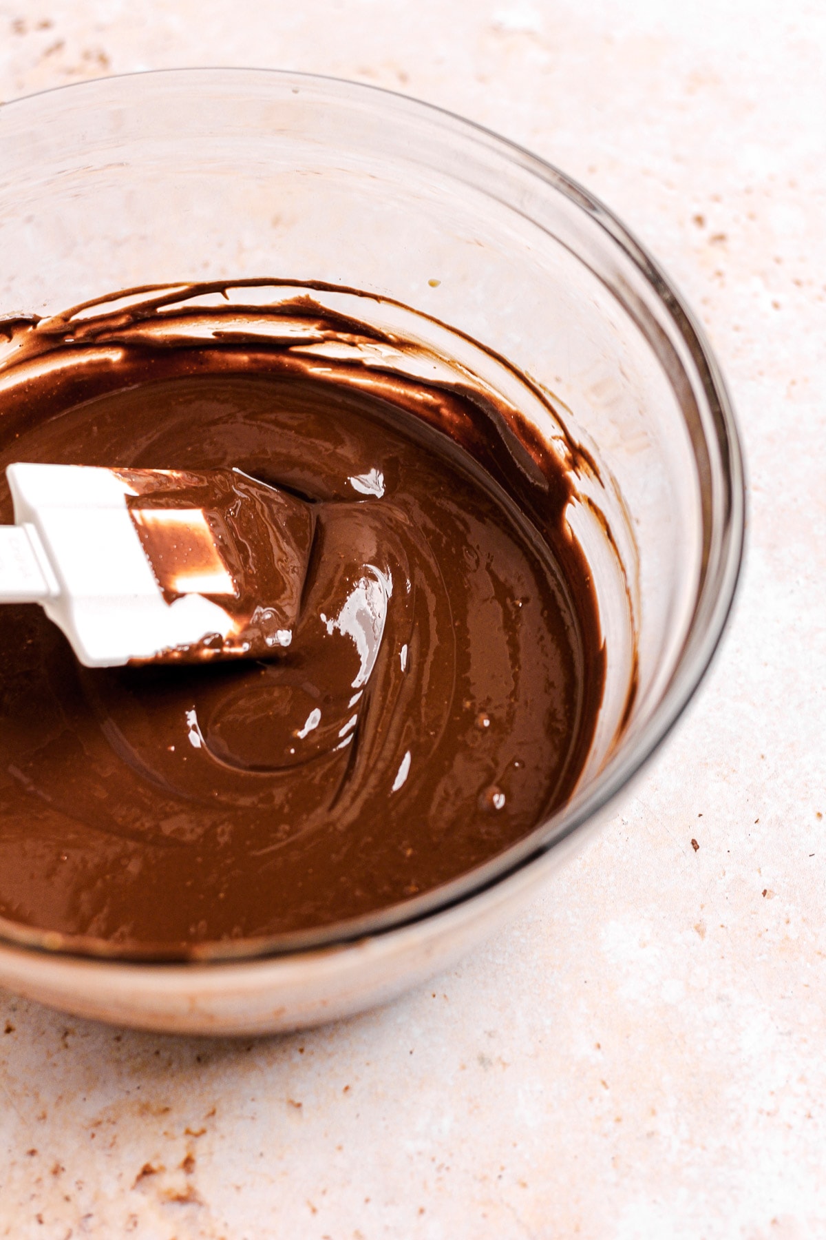 A mixing bowl of melted chocolate and peanut butter mixed together.