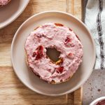 Strawberry cream cheese on a bagel.