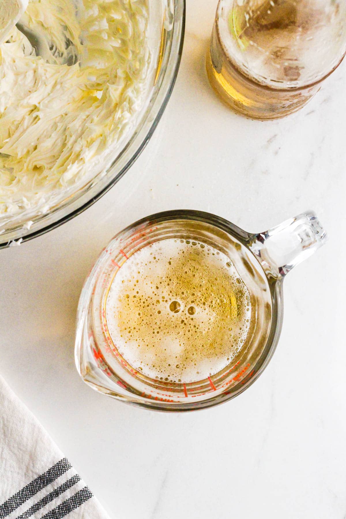 Light beer in a glass measuring cup for beer dip.