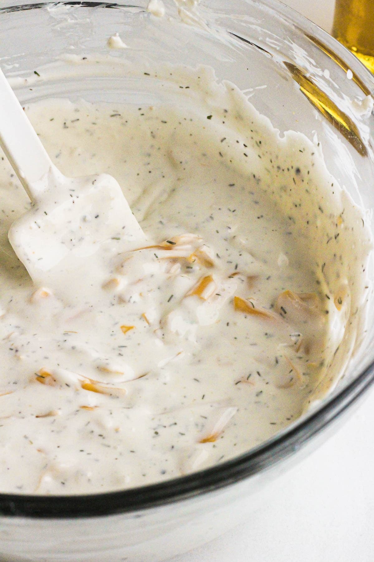 Cream cheese beer dip with shredded cheddar.