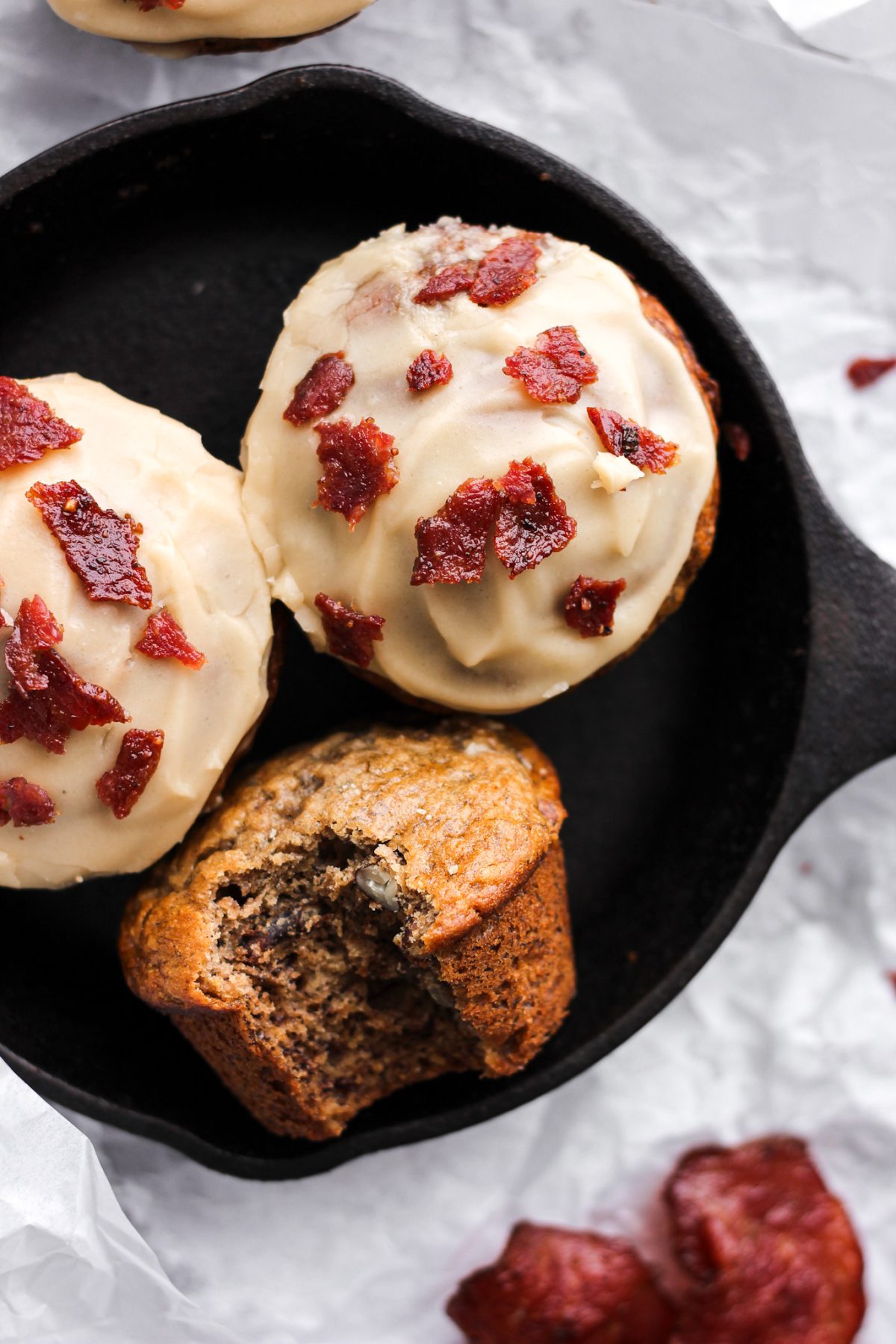 Banana Maple Bacon Muffins banana muffin with maple glaze and bacon in mini cast iron skillet for food blog and food photography