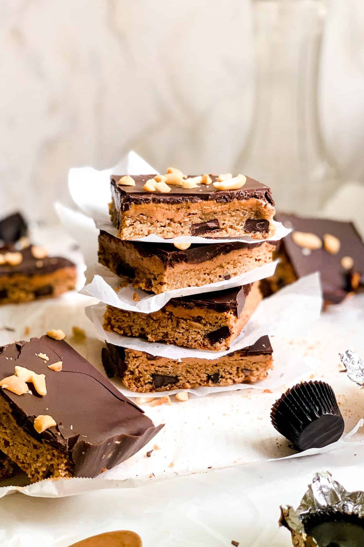 Stack of Homemade Dessert Bars with Peanut Butter and Melted Dark Chocolate